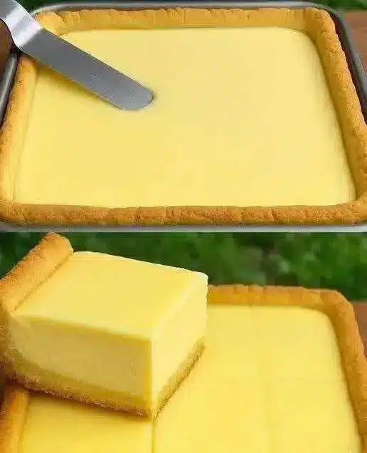 Fetta di crostata alla crema di limone servita su un piatto elegante con decorazione di menta