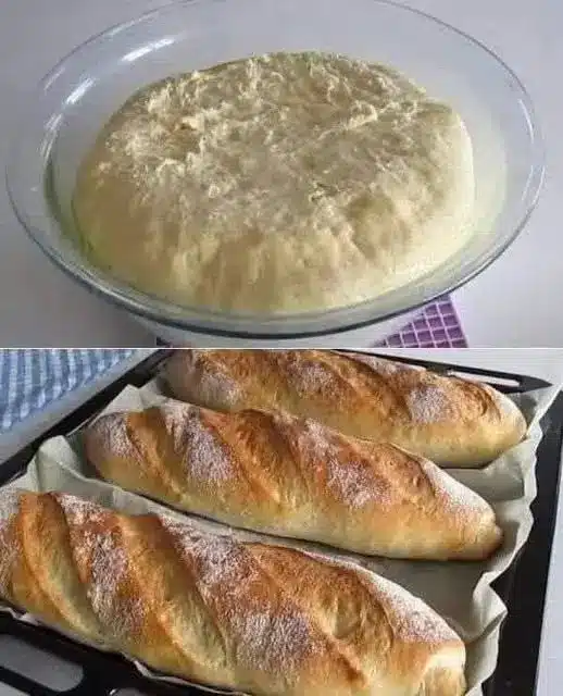 Pagnotta di pane fatto in casa appena sfornata e tagliata a fette su un tagliere